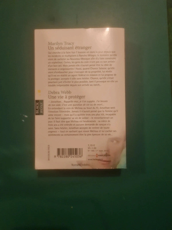 Marilyn Tracy
: Un séduisant étranger , Debra Webb
: Une vie à protéger